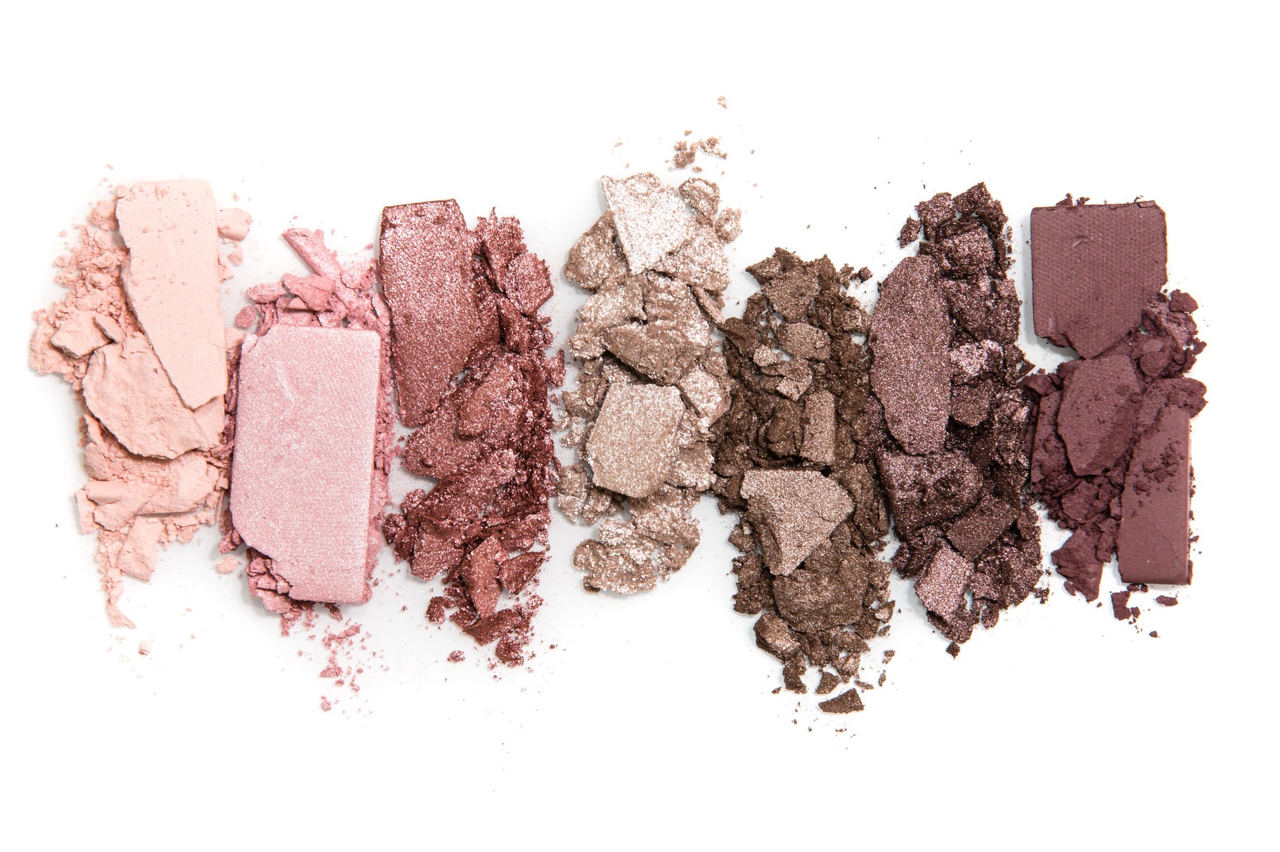 Smashed, neutral toned eyeshadow make up palette isolated on white background