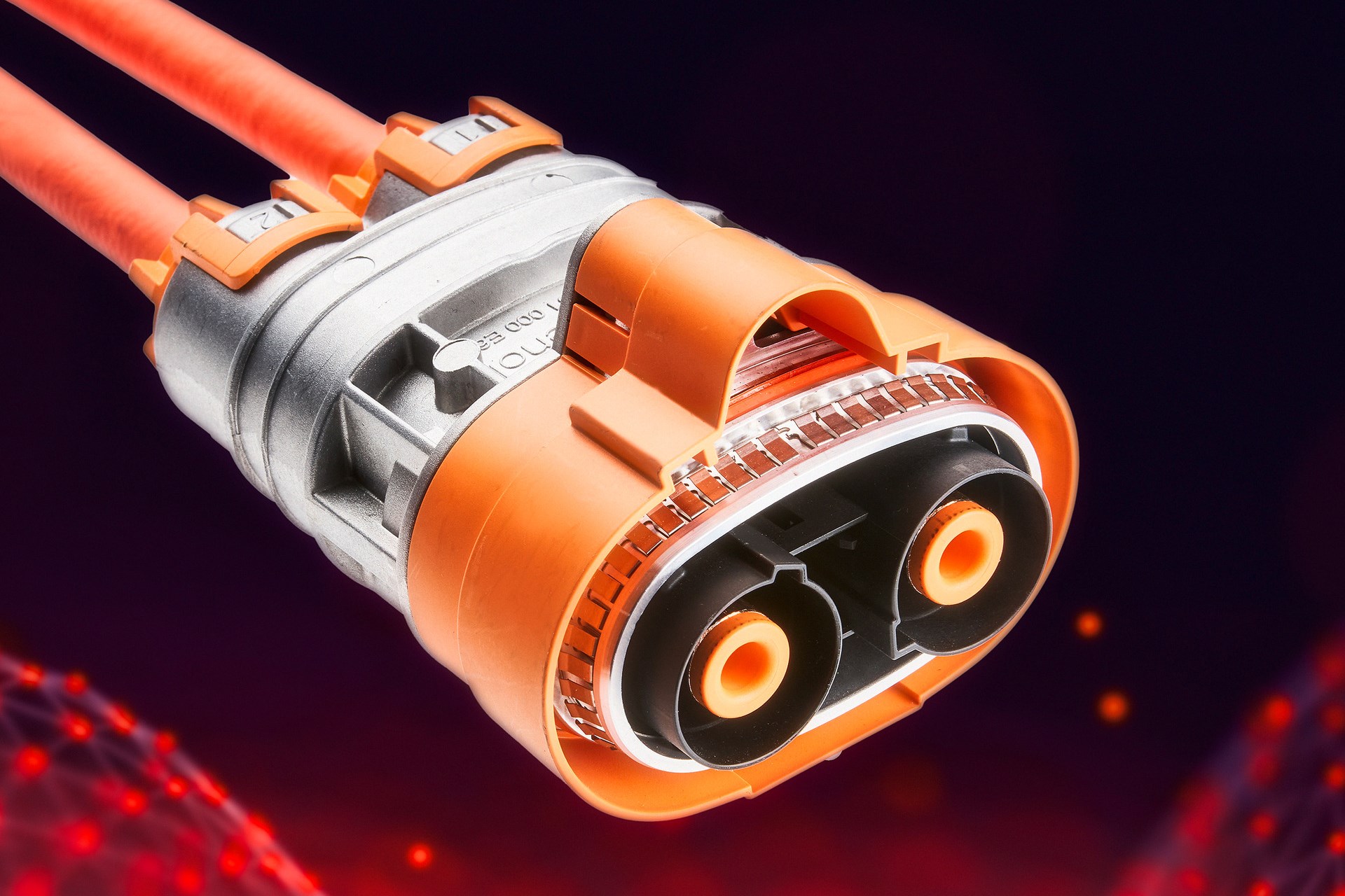 Connector made from Durethan BKV30FN04 for cable harnesses in electric models produced by a European-US automotive manufacturer. The halogen-free flame-retardant polyamide 6 can also be dyed in bright colors like orange (RAL 2003) 