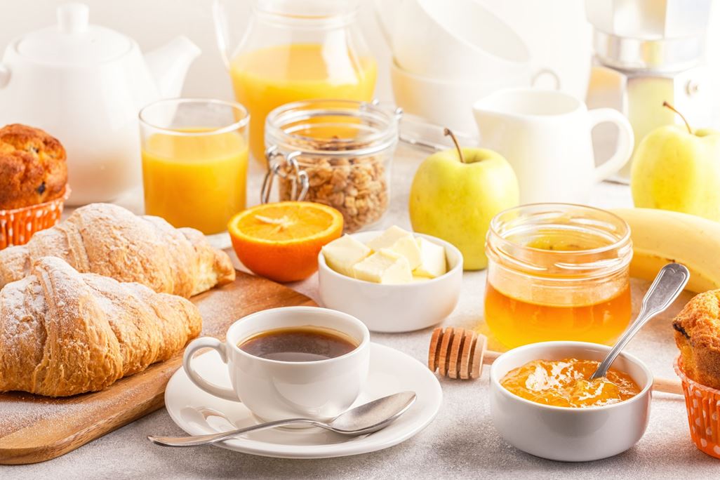 Continental breakfast with fresh croissants, orange juice and coffee