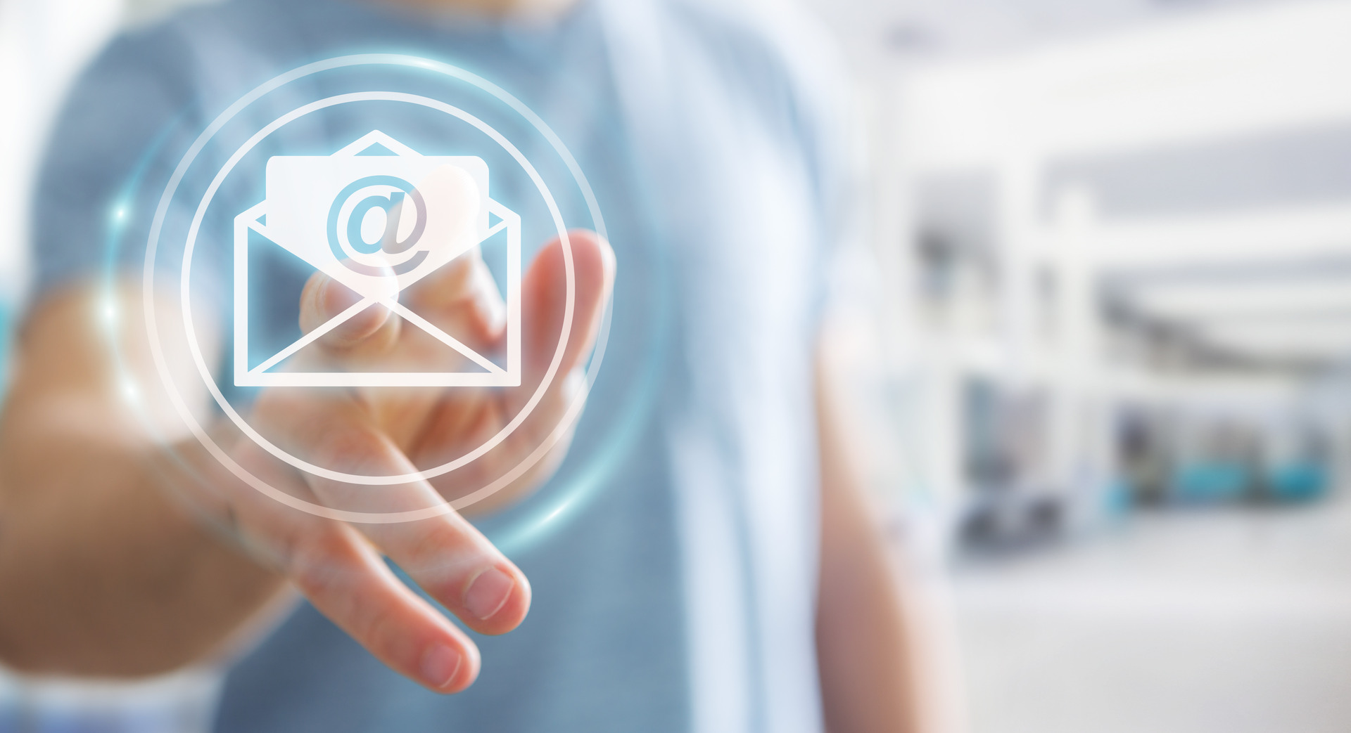 Businessman touching 3D rendering flying email icon with his finger