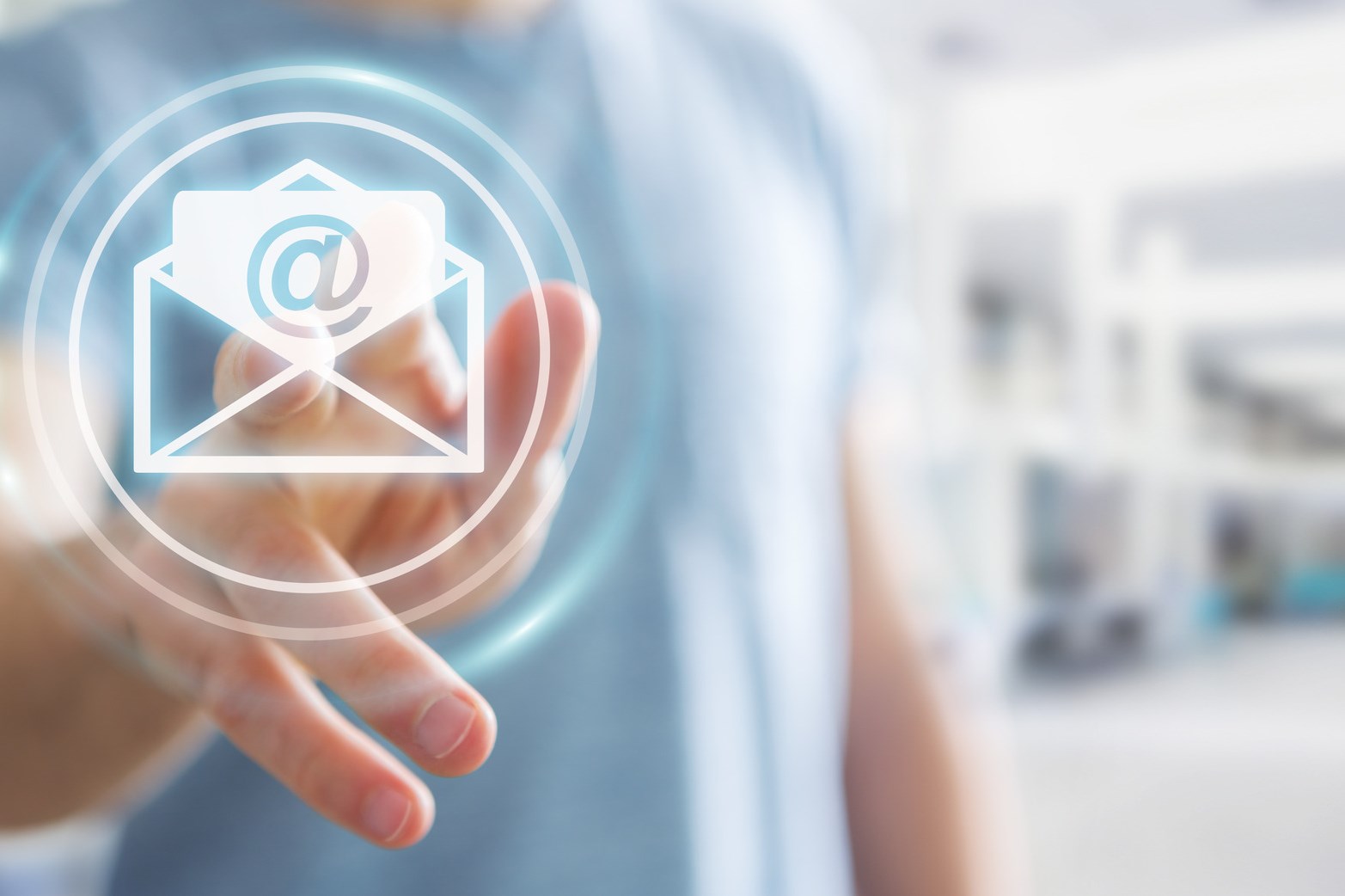 Businessman touching 3D rendering flying email icon with his finger