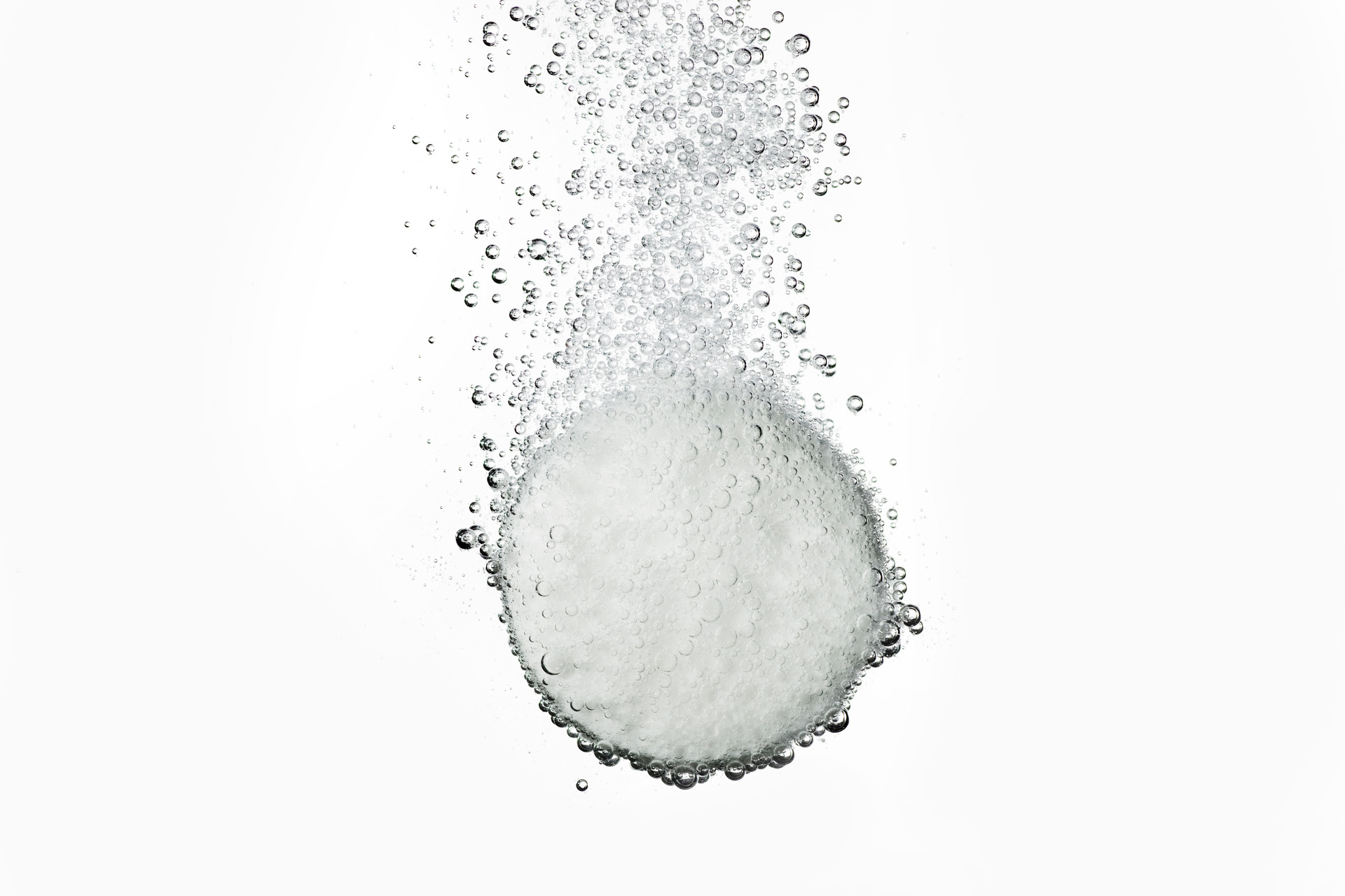 Effervescent tablet in water with bubbles