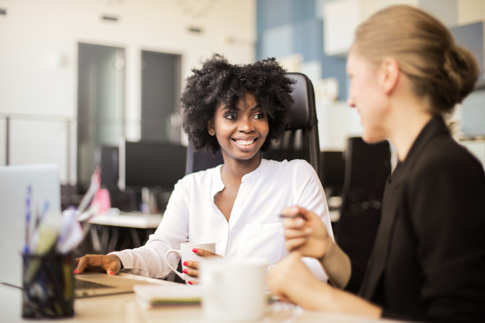 Two women in a casual meeting.