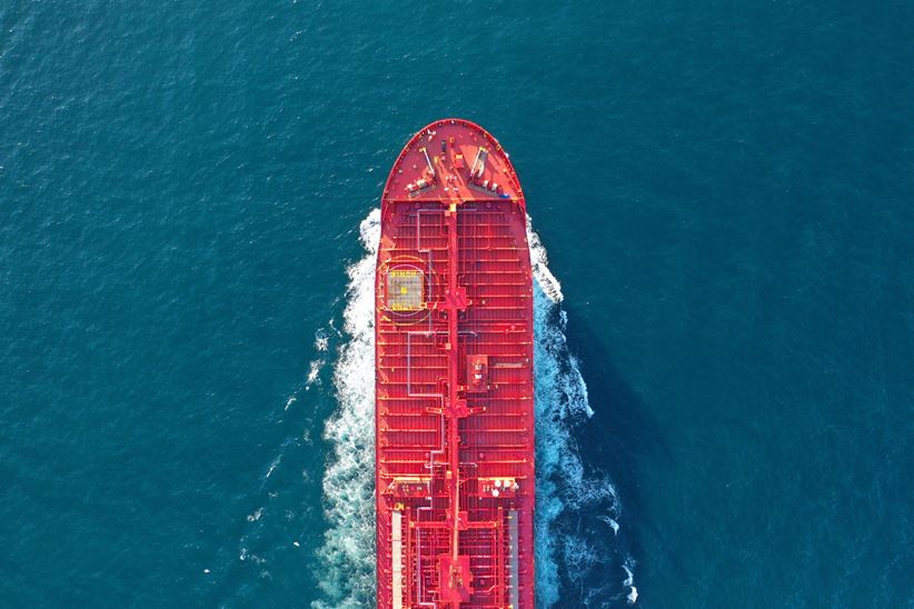 Aerial top down photo of industrial oil and fuel tanker cruising open ocean sea