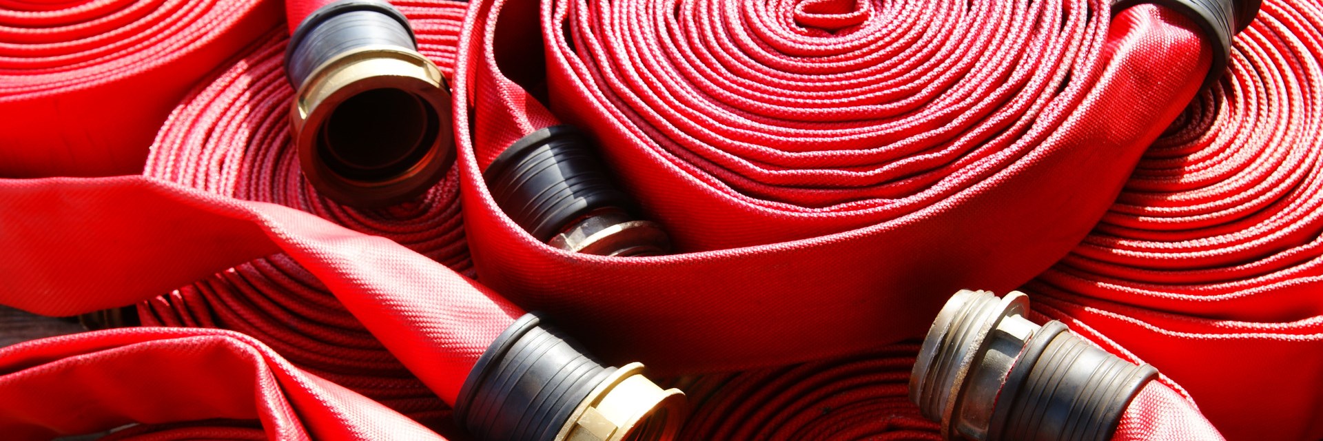 Red fire hoses rolled up