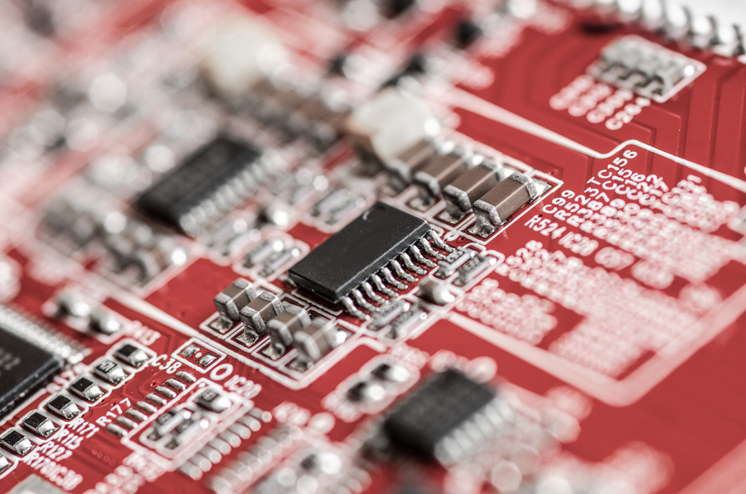 Computer board hardware motherboard microelectronics Server CPU chip semiconductor circuit core red technology background or red texture with processors concept electronic