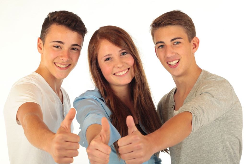 3 teenagers show thumbs up