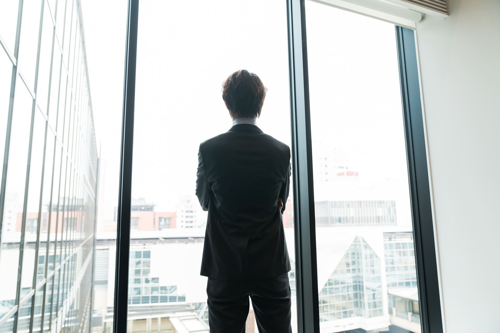 Businessman looks out the window