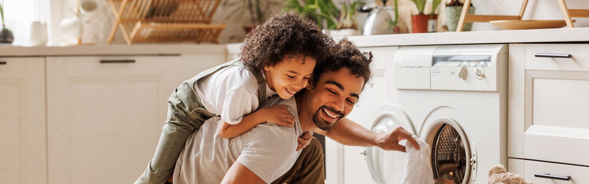 Father and son doing laundry together