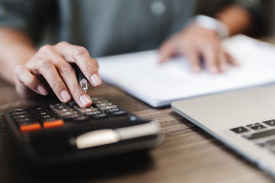 Female calculating personal financial for future plan at her home, taxes payment.
