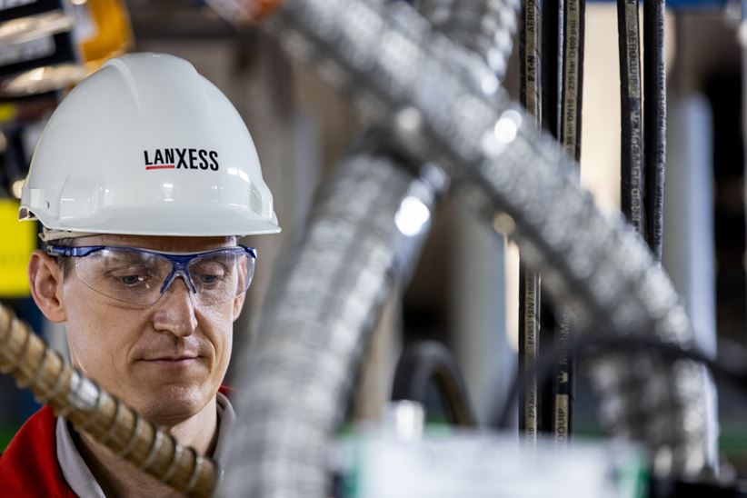 Employees at centrifuge for the production process of Bayowet C4