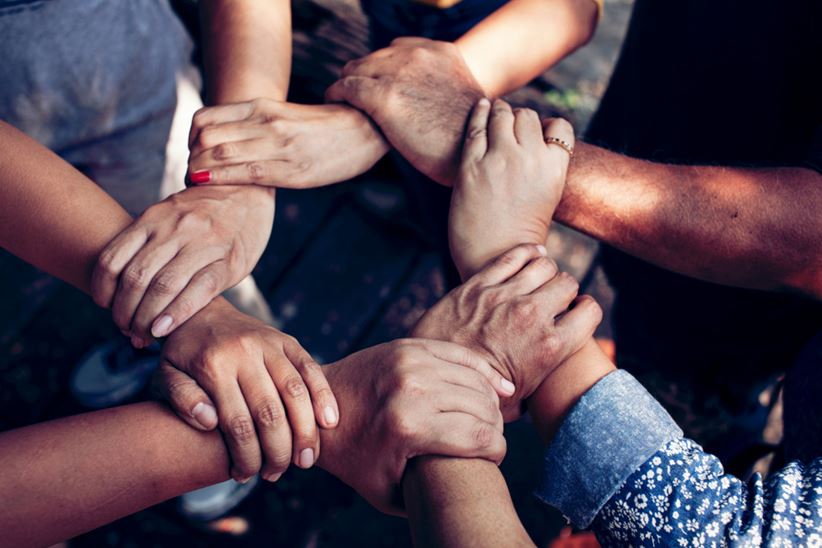 Team Work Concept : Group of Diverse Hands Together Cross Processing of young people in the nature