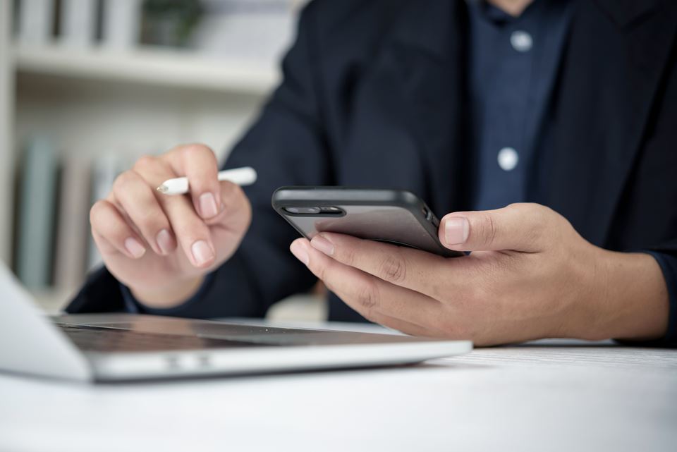 Man hands typing touchscreen cellphone browsing web reading message. Modern entrepreneur remote work job wireless gadget electronic connection commerce business strategy.