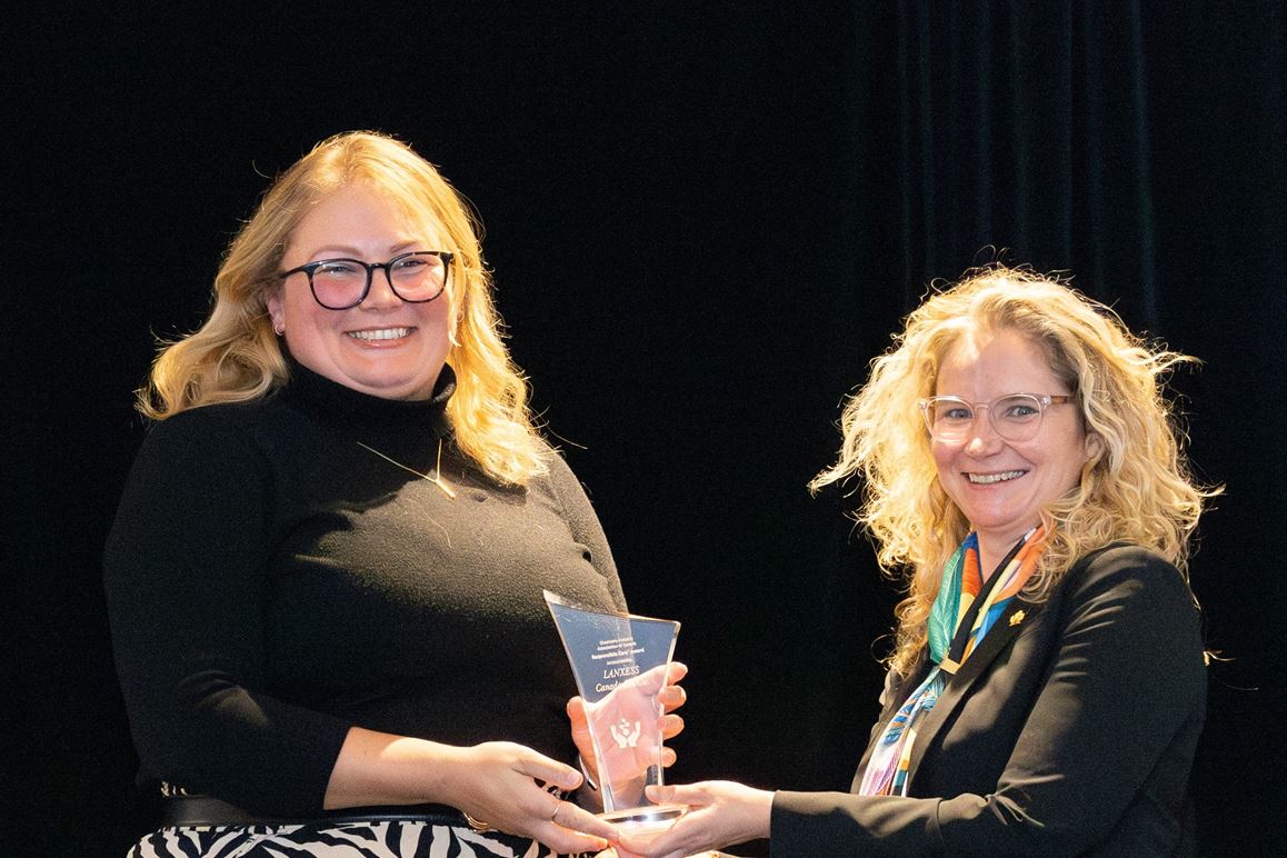 Katherine Down receives the Responsible Care Award in Canada from Kara Edwards.